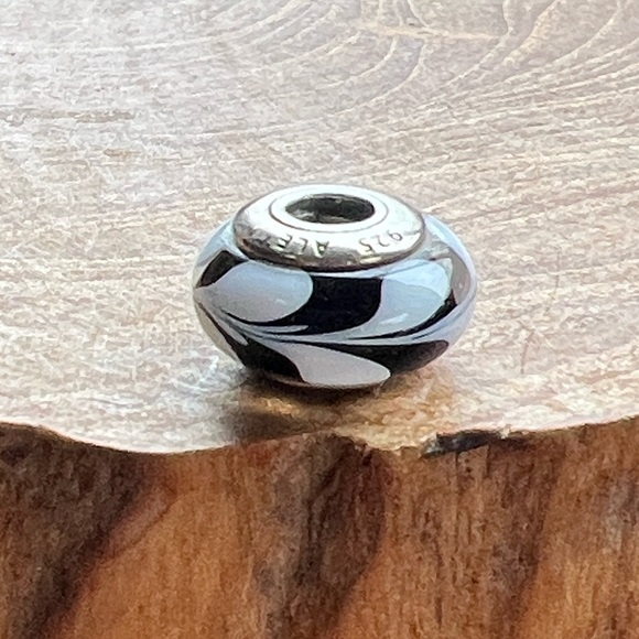 Pandora Retired Black and White Swirl
Murano Glass Charm - 790676 Sterling Core - Picture 3 of 6